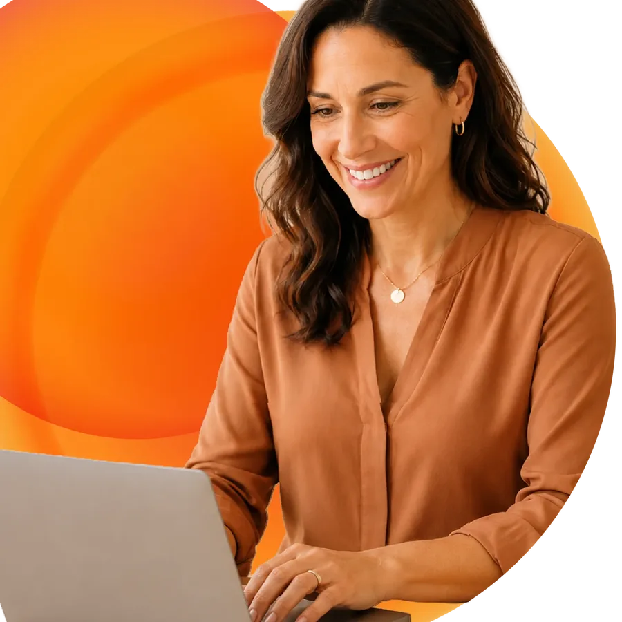 A practice manager updating her clinic website on a laptop